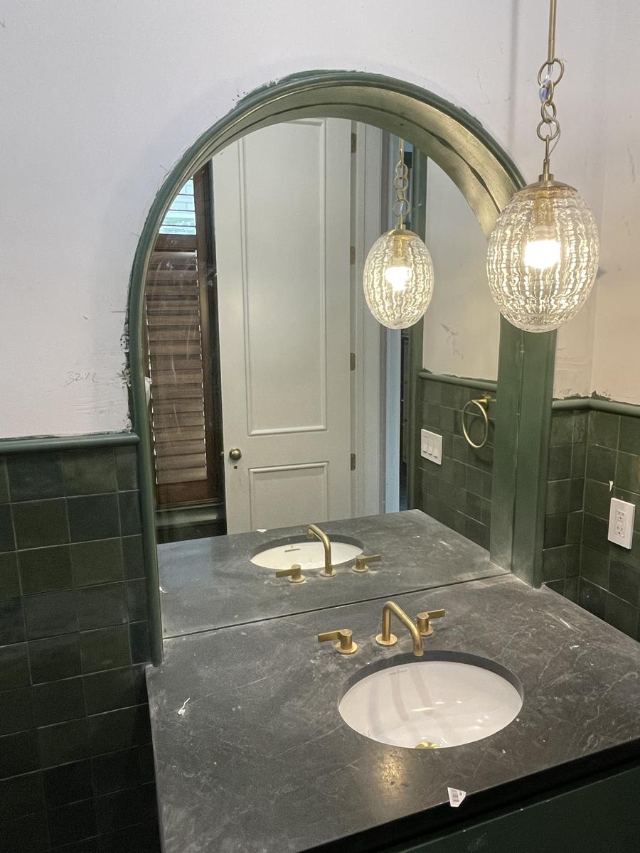 Custom-cut arched vanity mirror