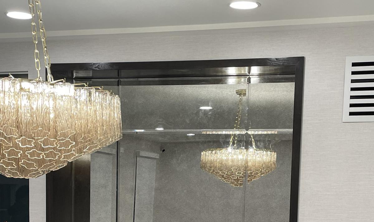 Beveled antique mirror panels in a dining room niche