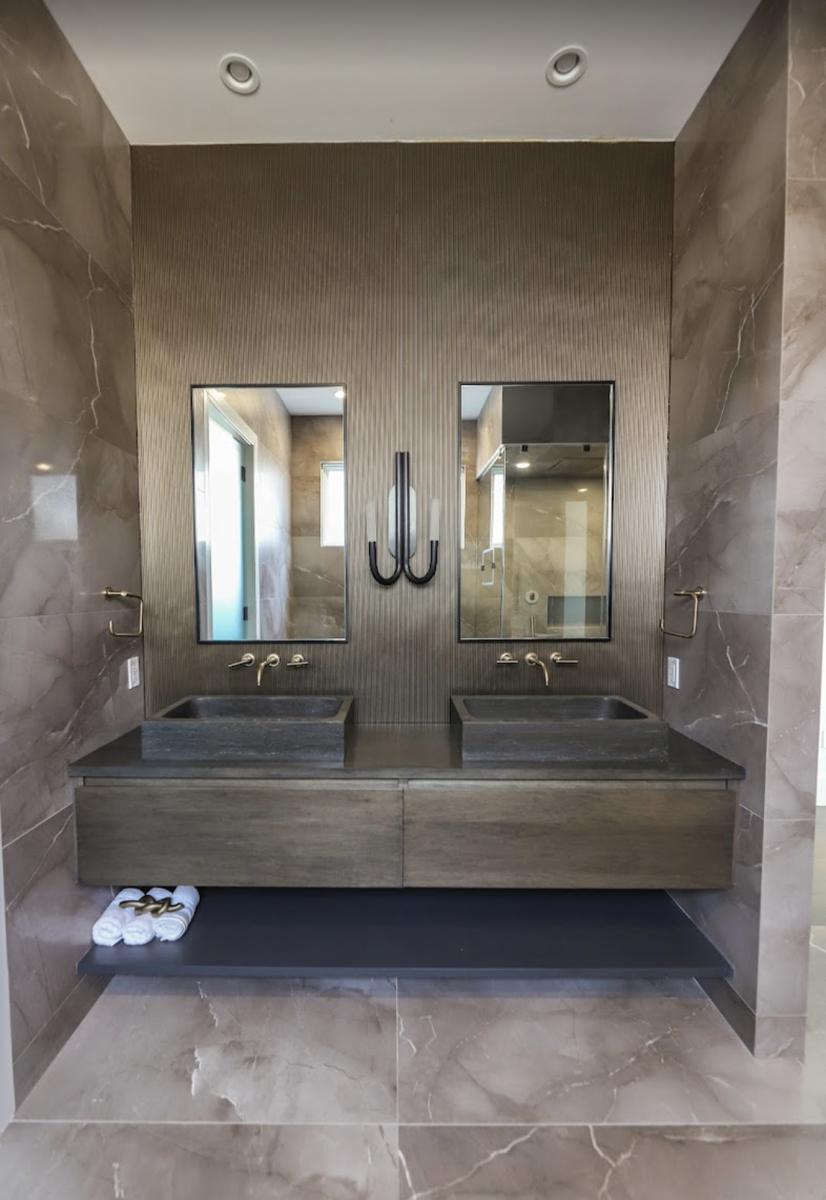 Pair of black-framed vanity mirrors over a double vanity