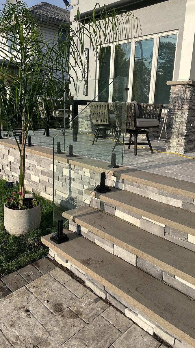 Exterior glass railing on patio stairs