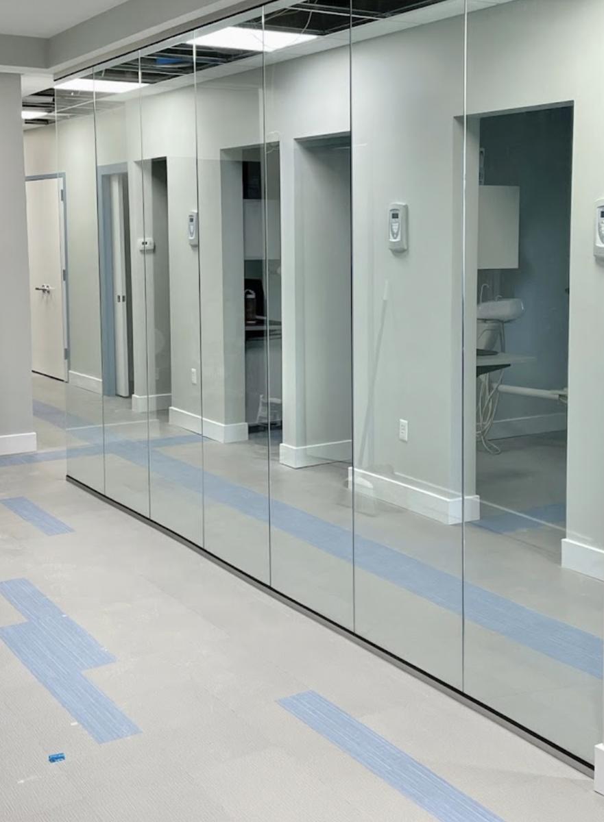 Frameless glass partition wall in a dental office