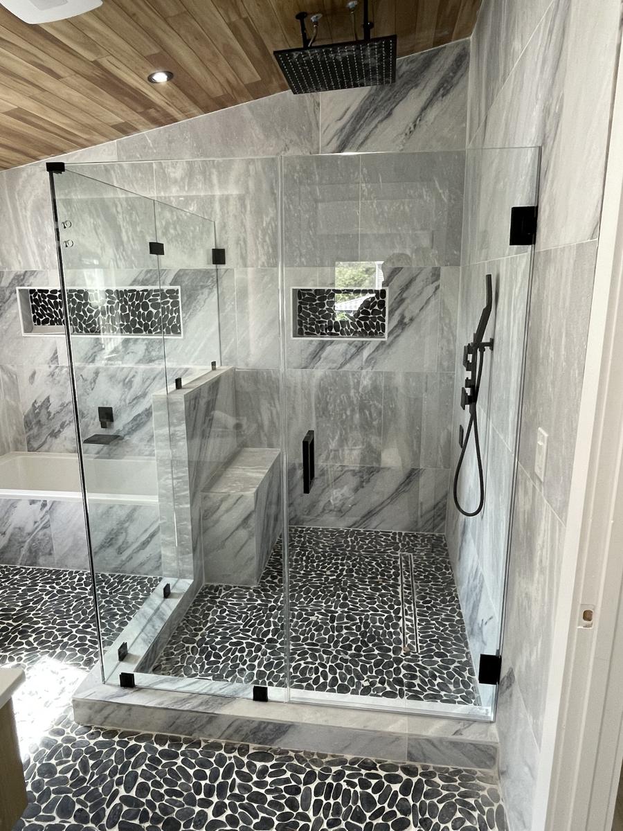 Frameless shower with matte black hardware