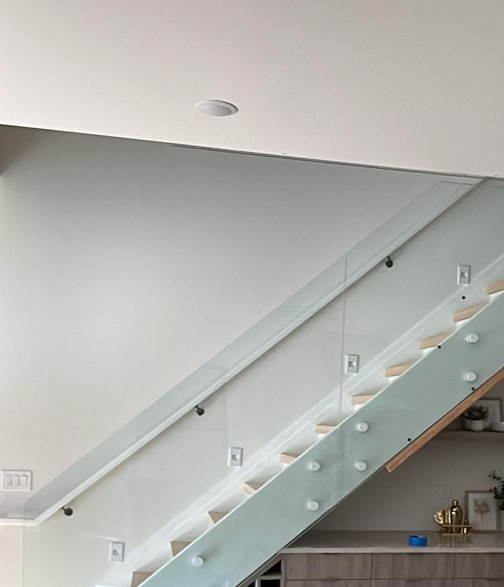 Frosted glass stair wall on standoffs