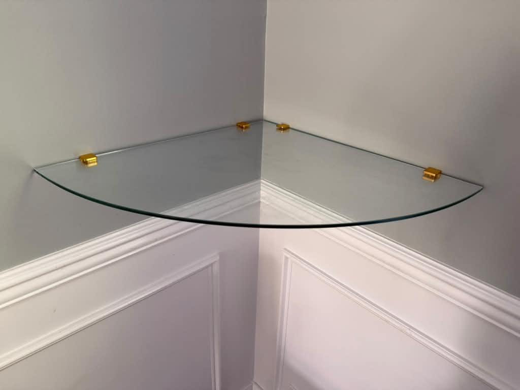 Glass corner shelf with gold clips