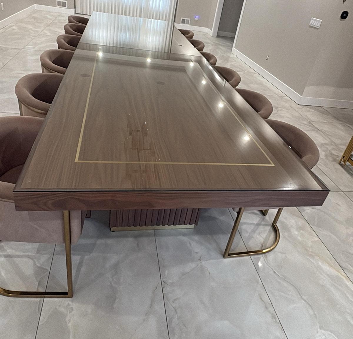 Custom glass top protecting a long dining table
