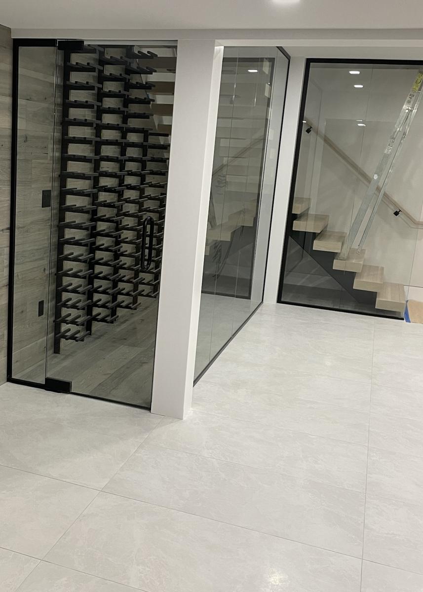 Glass wine room enclosure with black frame