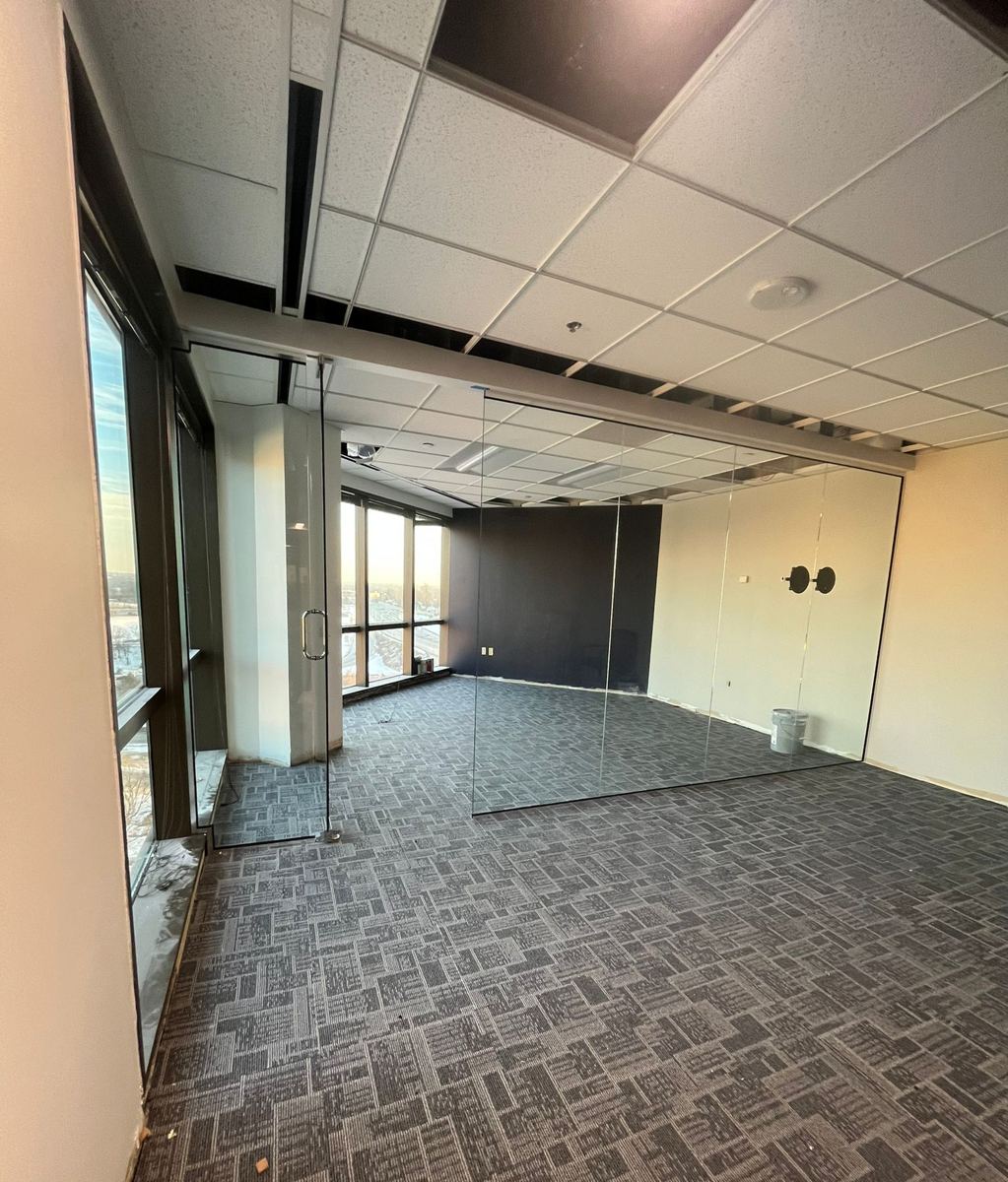 Glass conference room going in on a high-rise office floor
