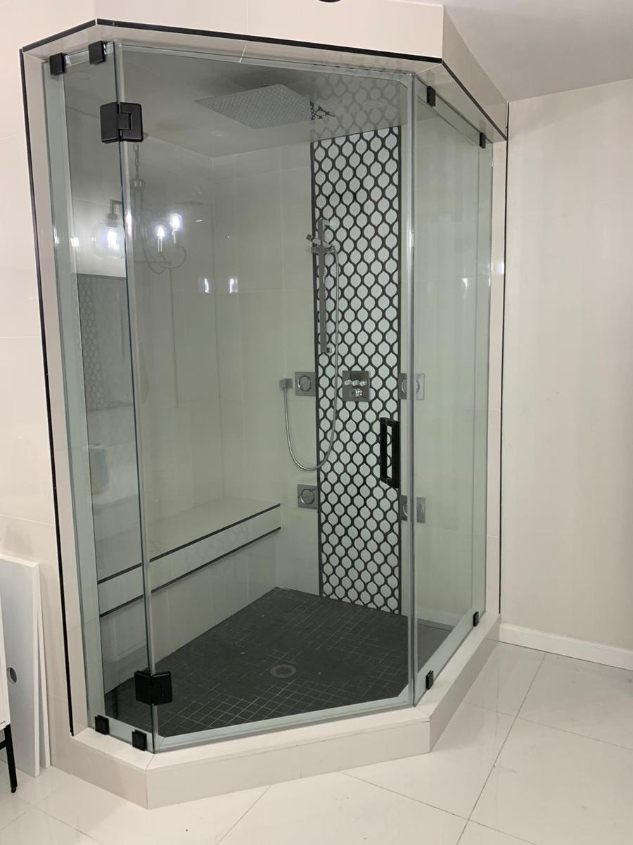 Neo-angle steam shower with black hardware