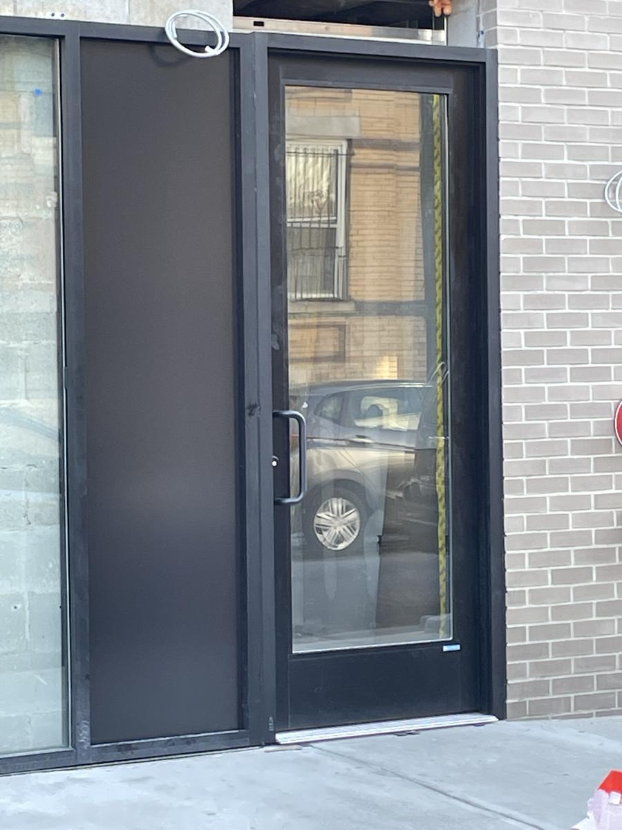 Aluminum storefront entrance door